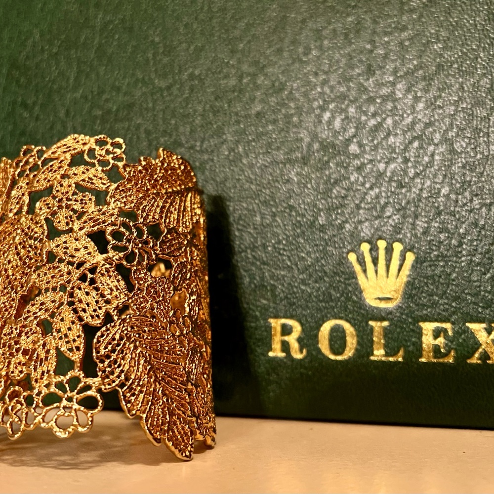 Stella and Dot gold cuff bracelet with beautiful milligram art work.